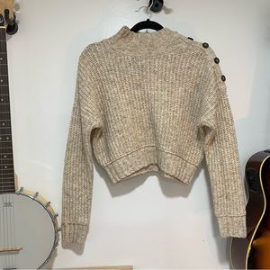 Neutral knitted sweater with button detail